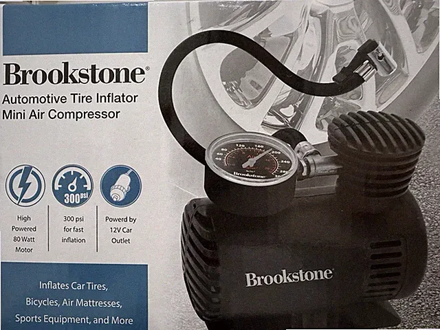 Brookstone Mini Air Compressor Automotive Tire Inflator 12V DC 300PSI New/Sealed